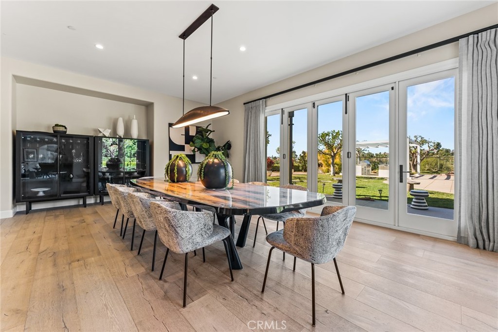11765 Riehl Avenue Tustin, CA 92782 - Photo 29 of 53 a view of a dining room with furniture window and wooden floor