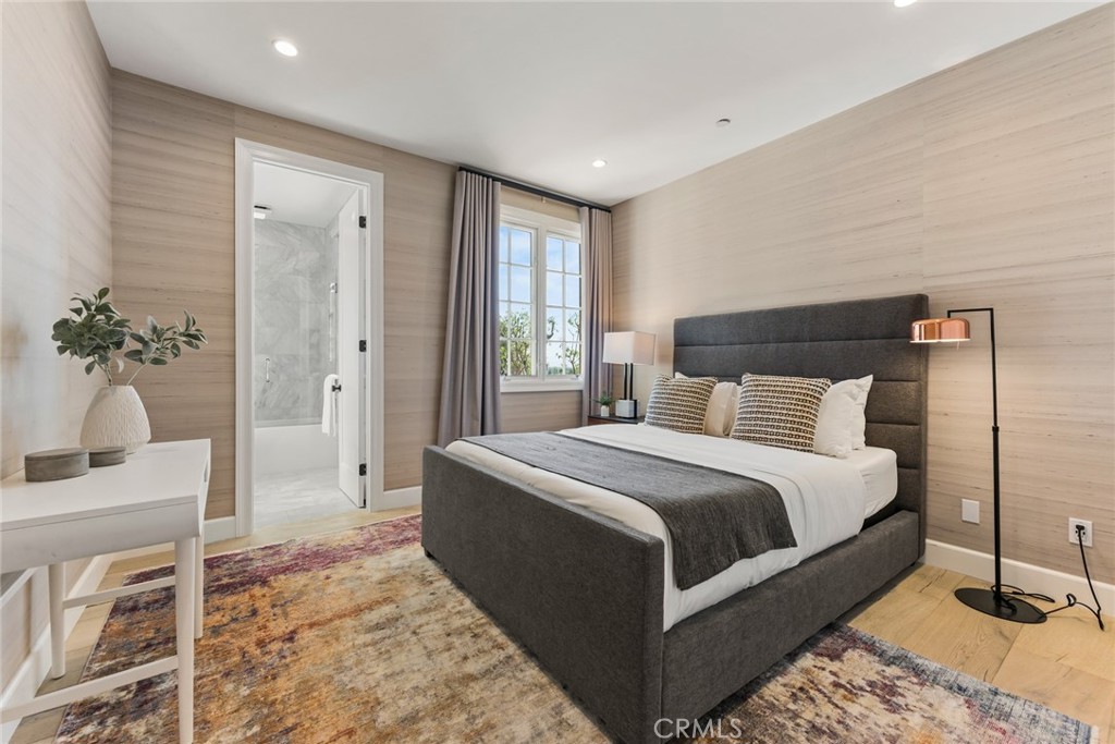 11765 Riehl Avenue Tustin, CA 92782 - Photo 43 of 53 a bedroom with a large bed and a chandelier