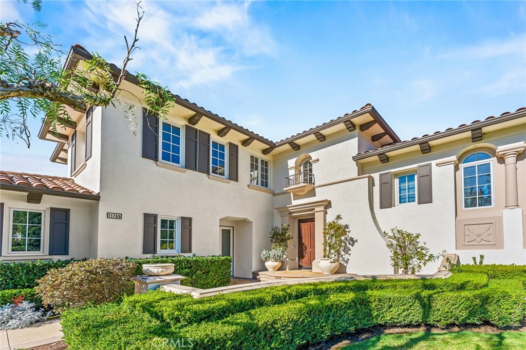 11765 Riehl Avenue Tustin, CA 92782 - Photo 7 of 53 a front view of a house with garden