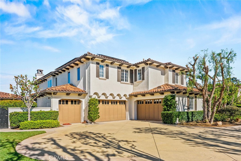 11765 Riehl Avenue Tustin, CA 92782 - Photo 9 of 53 a front view of a house with a yard