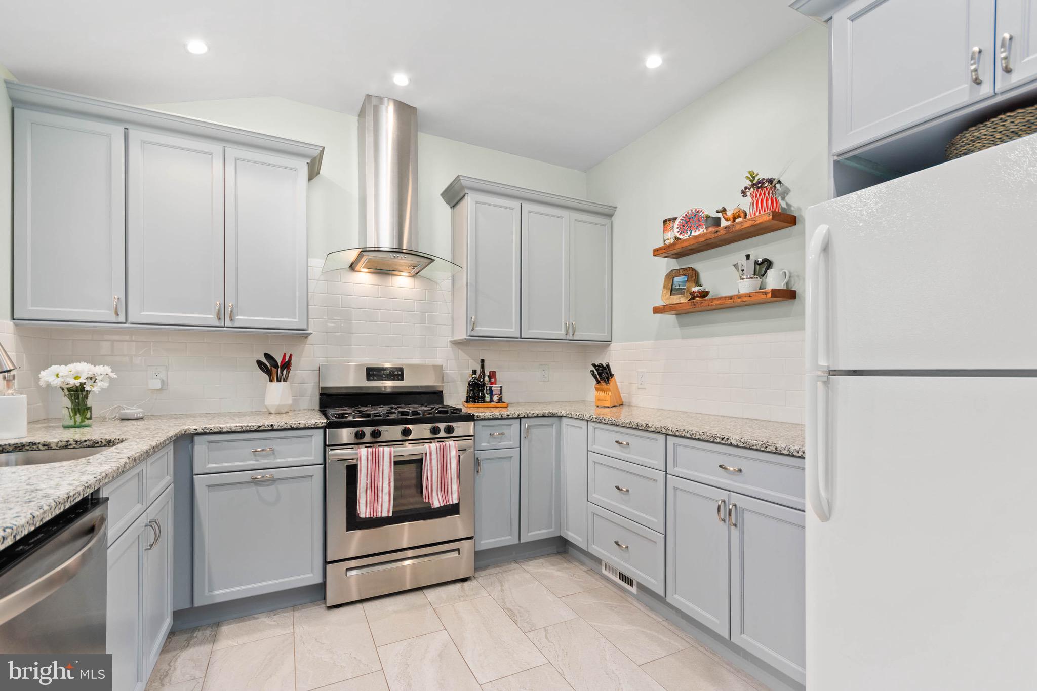 3 Surrey Road Voorhees, NJ 08043 - Photo 11 of 28 a kitchen with a white cabinets and white appliances