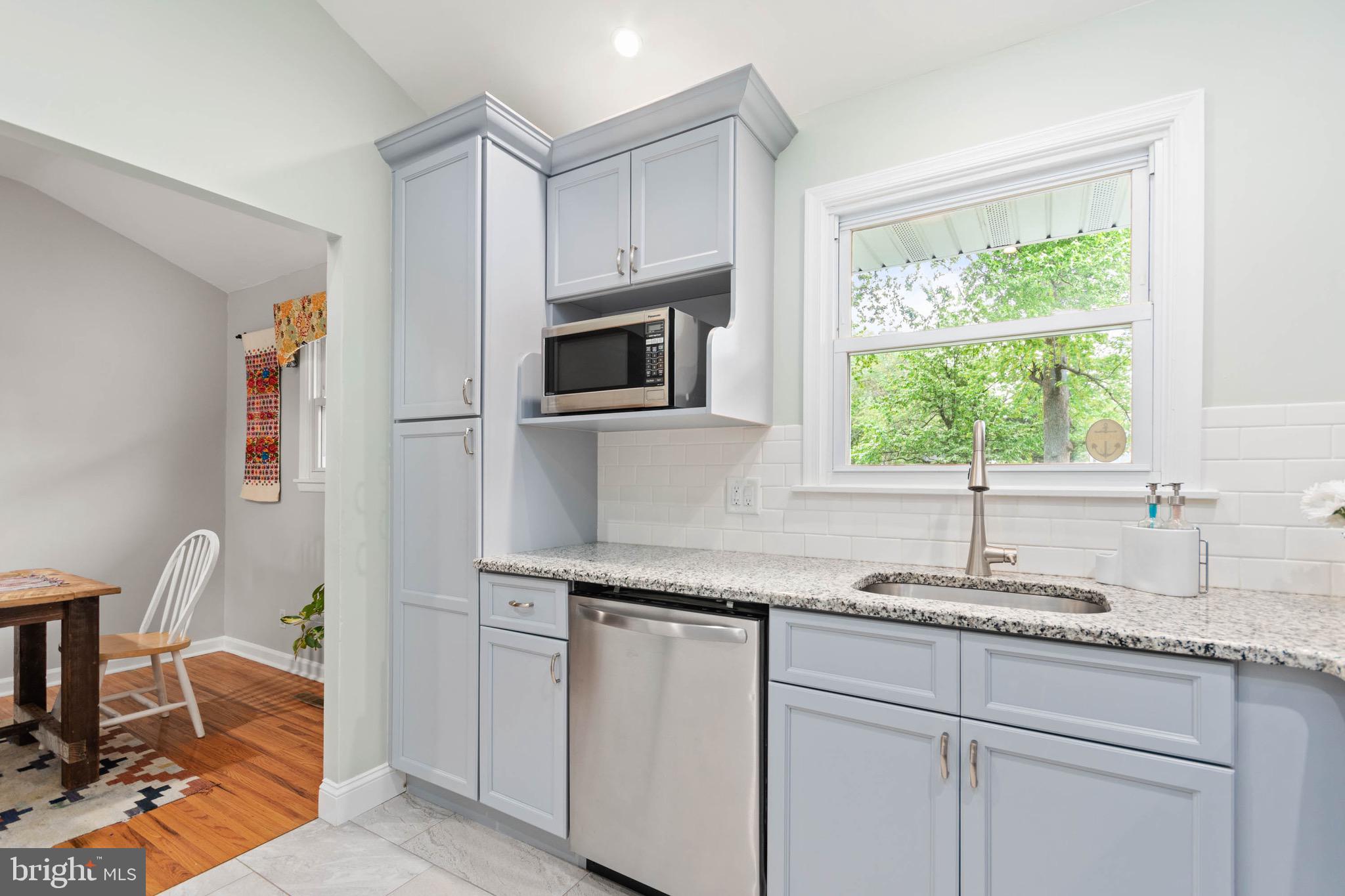 3 Surrey Road Voorhees, NJ 08043 - Photo 12 of 28 a kitchen with granite countertop cabinets stainless steel appliances a sink and a window