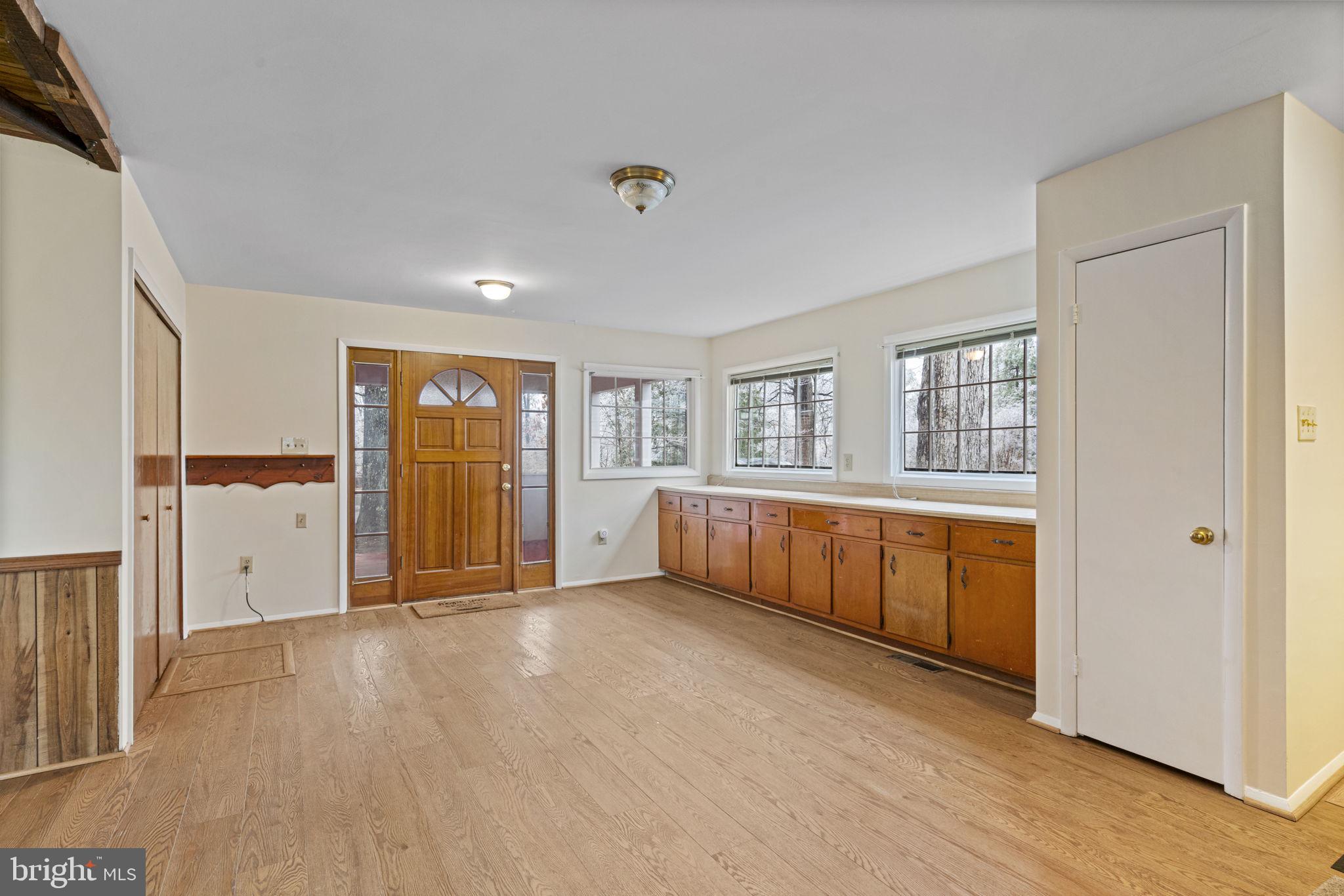 4954 Catharpin Road Gainesville, VA 20155 - Photo 14 of 24 Family Room and Closet with Washer and Dryer