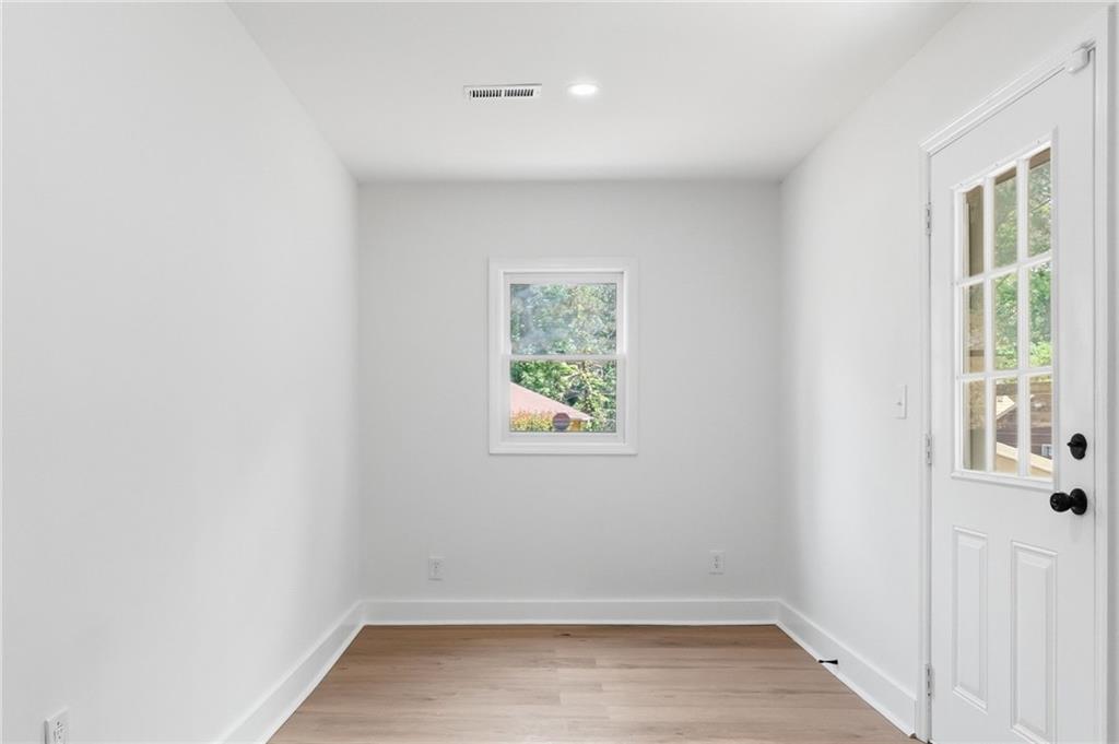 1808 Singer Way Lithonia, GA 30058 - Photo 14 of 37 an empty room with windows