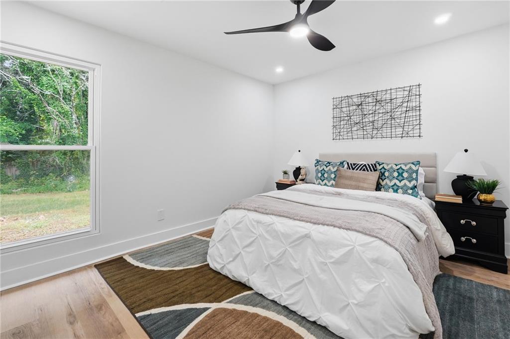 1808 Singer Way Lithonia, GA 30058 - Photo 25 of 37 a bedroom with a bed and a window