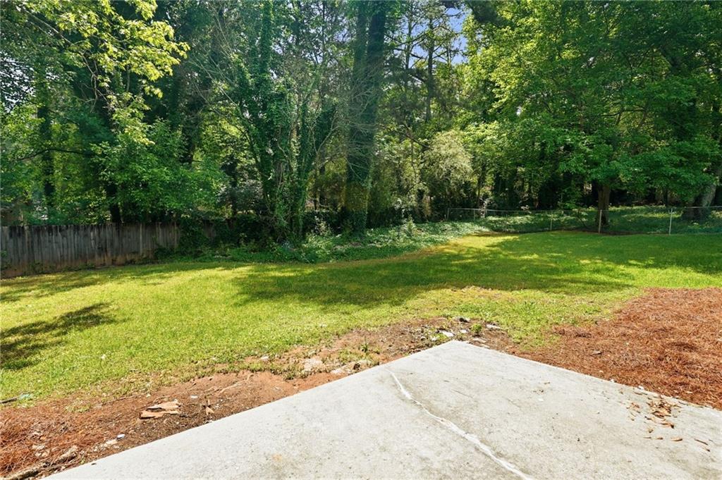 1808 Singer Way Lithonia, GA 30058 - Photo 28 of 37 a view of a backyard with a garden