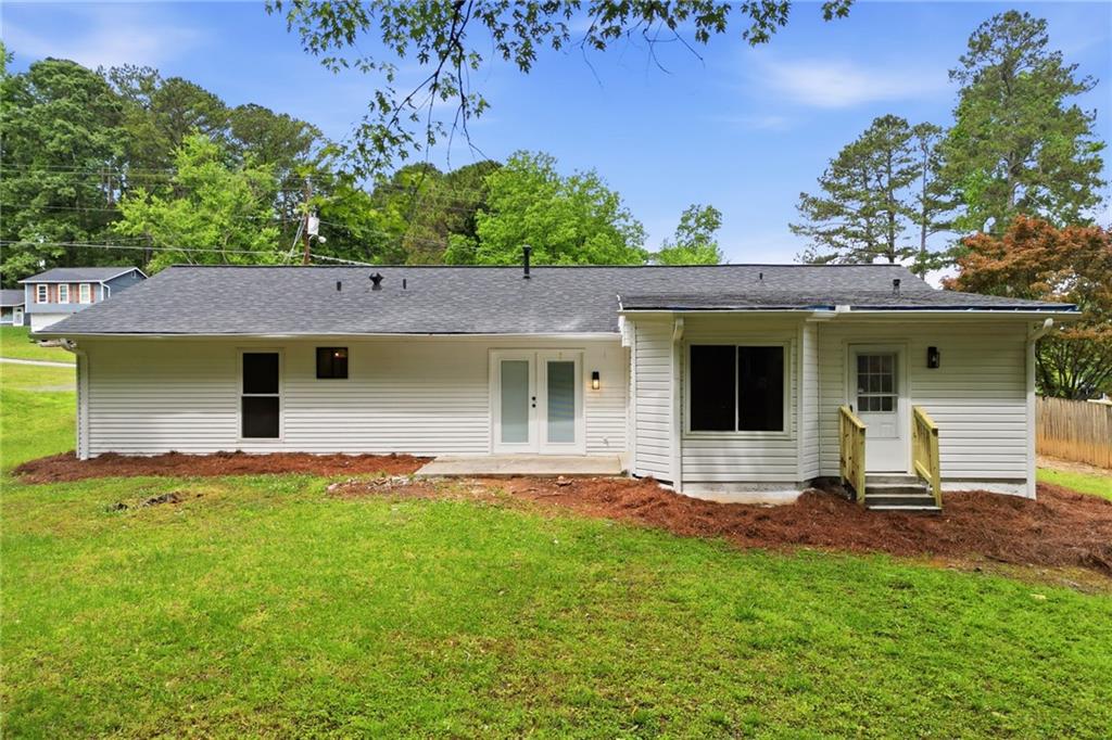 1808 Singer Way Lithonia, GA 30058 - Photo 29 of 37 a view of a backyard with a garden and plants
