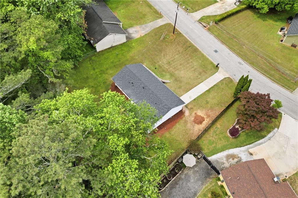 1808 Singer Way Lithonia, GA 30058 - Photo 31 of 37 an aerial view of a house with a yard and lake view