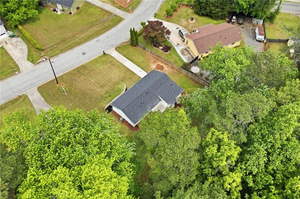 1808 Singer Way Lithonia, GA 30058 - Photo 32 of 37 an aerial view of a house with a yard