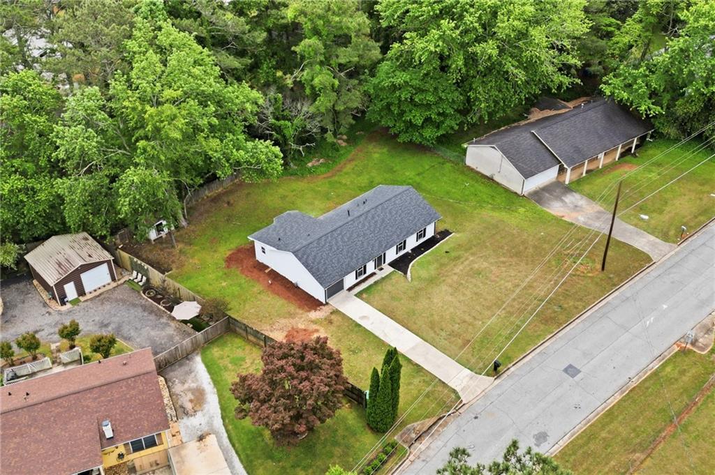 1808 Singer Way Lithonia, GA 30058 - Photo 34 of 37 an aerial view of a house with a swimming pool