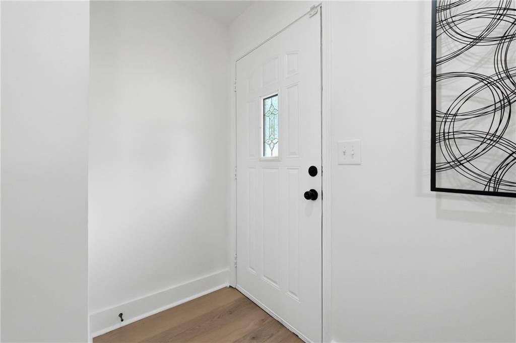 1808 Singer Way Lithonia, GA 30058 - Photo 5 of 37 a view of a room with wooden floor