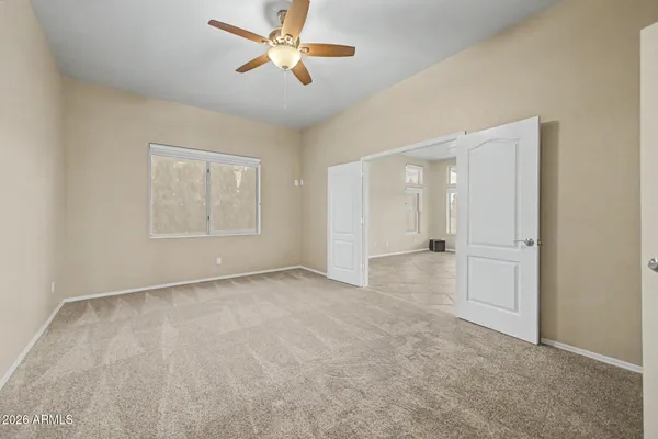 a view of an empty room with a window