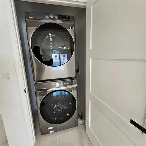 an empty room with windows and entrance