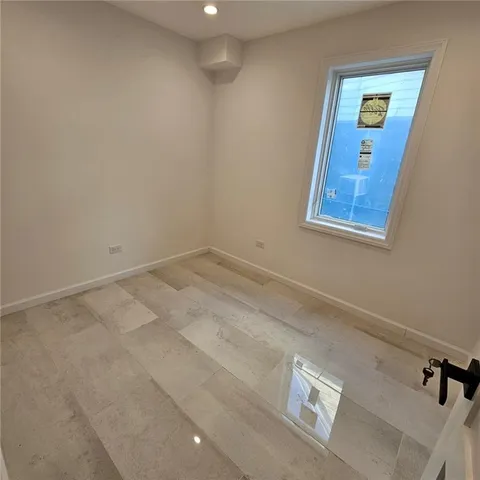 a view of balcony with wooden floor