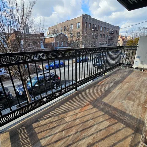 en empty room with windows and chandelier
