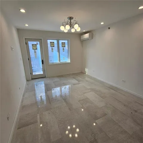 a kitchen with stainless steel appliances a stove a refrigerator and a sink