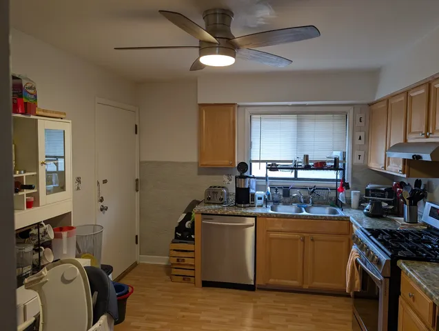 a kitchen with a stove and a sink