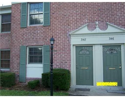 a front view of a house with yard