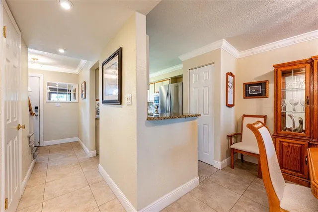 a bed sitting in a spacious bedroom next to a window