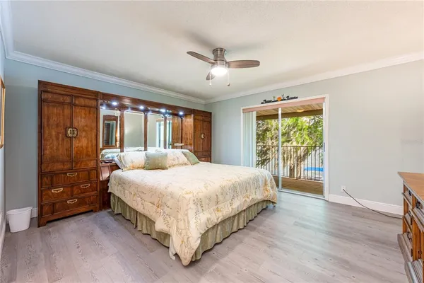a bedroom with a large bed and a large window