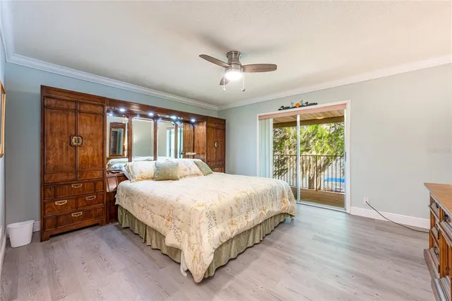 a bedroom with a large bed and a large window