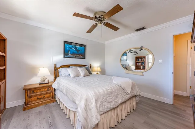 a bedroom with a bed a desk and chair