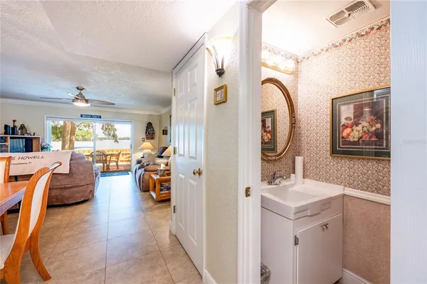 view of a hallway with stairs and a closet