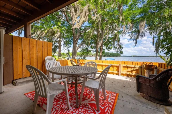 a building outdoor space with patio furniture and potted plants