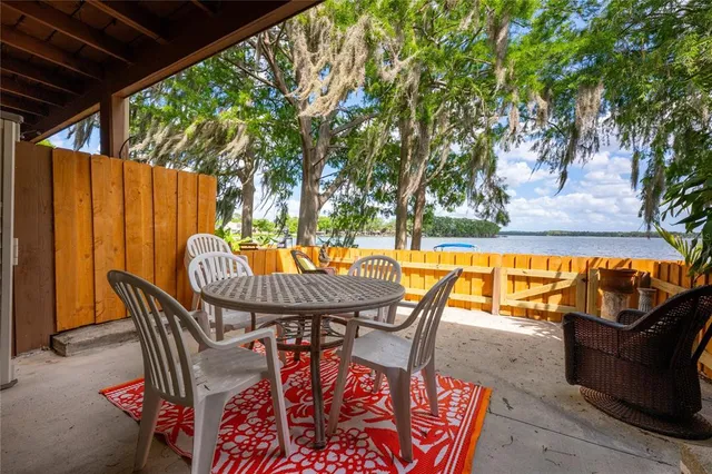 a building outdoor space with patio furniture and potted plants