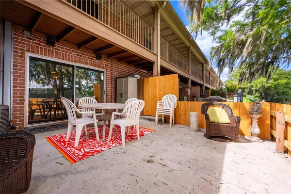 a view of a chairs and table in the patio