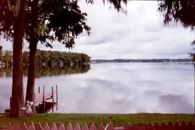 a view of a swimming pool with lounge chairs
