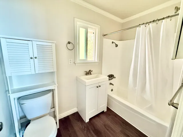 a bathroom with a toilet a sink and a bathtub