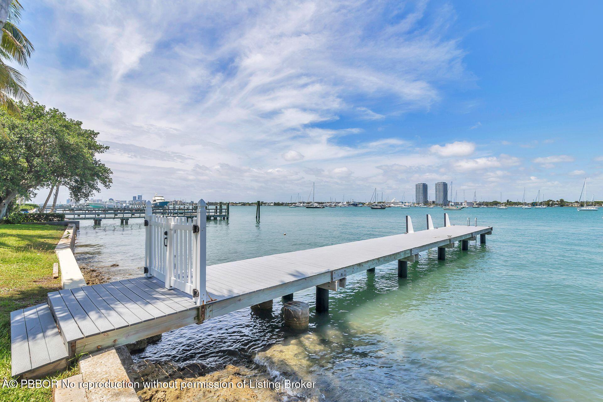 255 Colonial Lane Palm Beach, FL 33480 - Photo 32 of 32 a view of a lake with a terrace