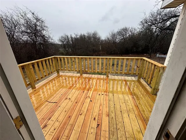 a view of hallway with wooden floor