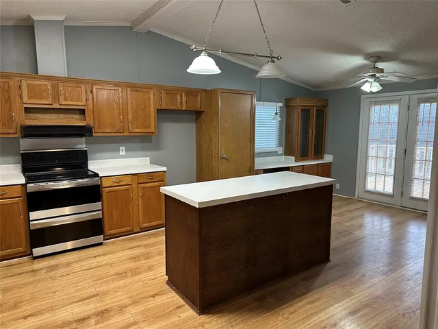 a kitchen with a stove and a microwave