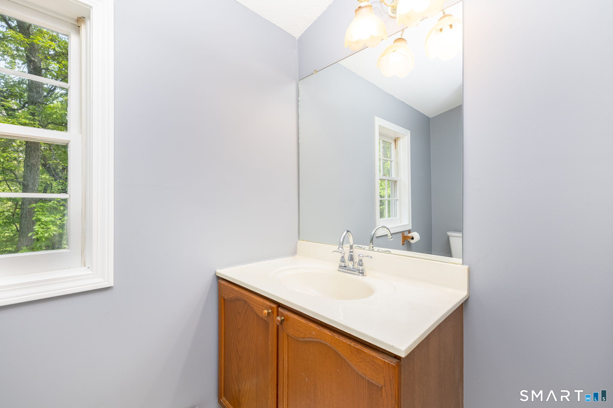175 Vernon Street Manchester, CT 06042 - Photo 21 of 38 a bathroom with a sink and a mirror