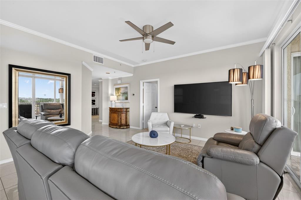 2060 Matecumbe Key Road, Unit 2506 Punta Gorda, FL 33955 - Photo 12 of 38 a living room with furniture and a flat screen tv