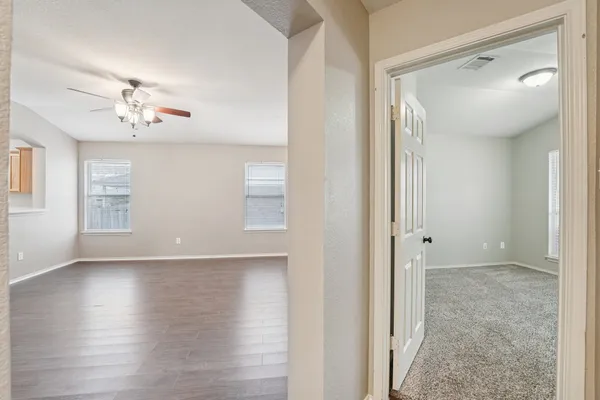 a view of livingroom with hardwood floor and a ceiling fan