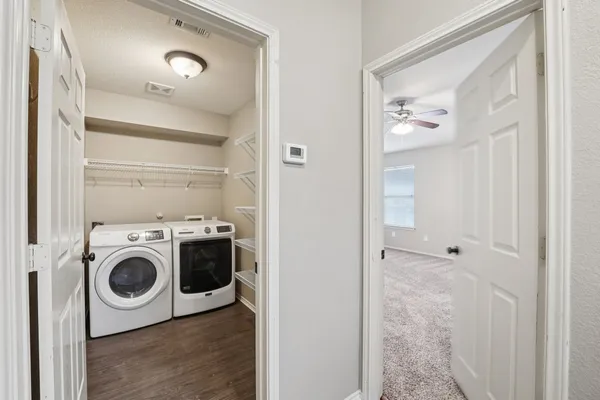 a utility room with dryer and washer