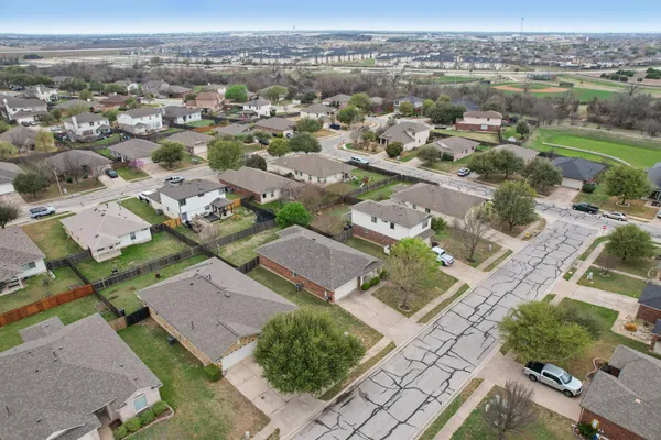 an aerial view of a house with a lake view