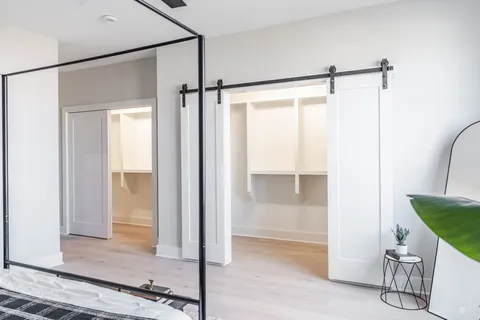 a bathroom with a shower and a glass door