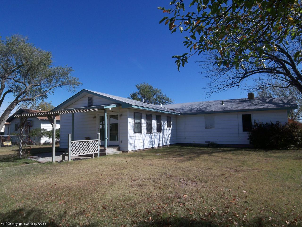 3814 Parker Street Amarillo, TX 79110 - Photo 10 of 13 a view of a house with a yard and sitting area