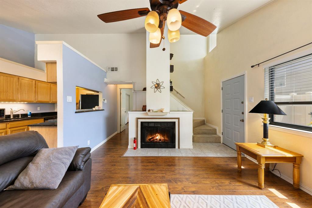 2240 Tarpley Road, Unit 411 Carrollton, TX 75006 - Photo 1 of 28 a living room with furniture and a fireplace