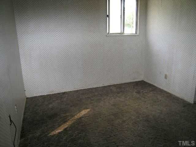 1913 Crawford Road Raleigh, NC 27610 - Photo 12 of 12 an empty room with a window