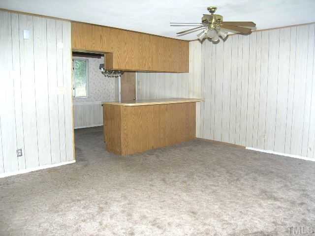 1913 Crawford Road Raleigh, NC 27610 - Photo 3 of 12 a view of a room with cabinet and a chandelier fan