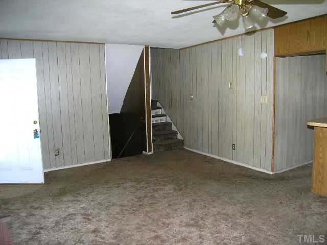 1913 Crawford Road Raleigh, NC 27610 - Photo 4 of 12 a view of an empty room with a fireplace