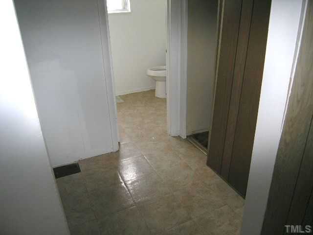 1913 Crawford Road Raleigh, NC 27610 - Photo 10 of 12 a view of a bathroom from a hallway