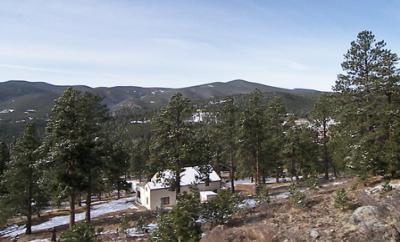 34695 Ranchero Road Evergreen, CO 80439 - Photo 1 of 1 a view of a city with mountain