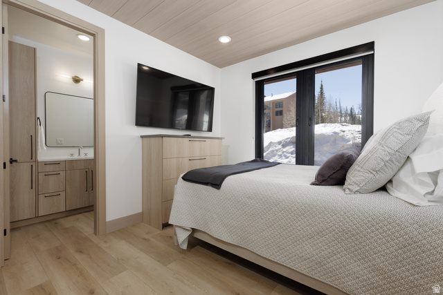 160 Ridgeview Street, Unit 7B Brian Head, UT 84719 - Photo 16 of 40 Bedroom featuring light wood-style flooring, recessed lighting, en-suite bathroom on main level