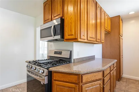a kitchen with a stove and a microwave